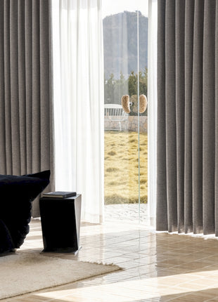 a living room with a large sliding glass door