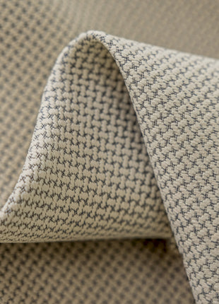 a close up of a gray and white fabric