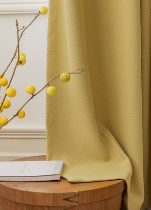 a vase with some yellow balls on it