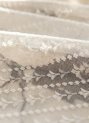 a close up of a piece of cloth with flowers on it