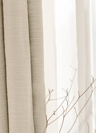 a close up of a window with a branch in front of it