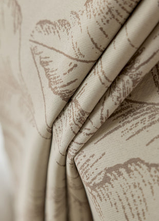 a close up of a curtain with a flower pattern