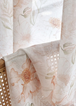 a close up of a curtain with flowers on it