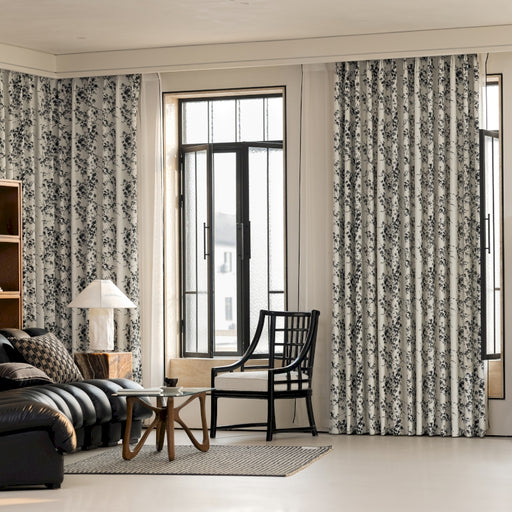 a living room filled with furniture and a large window