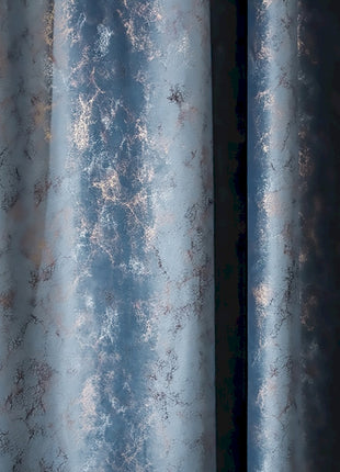 a close up of a curtain with a blue background