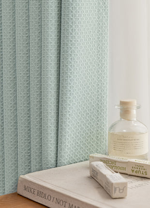 a book and a bottle sitting on a table