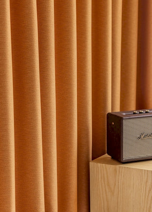 a radio sitting on top of a wooden block