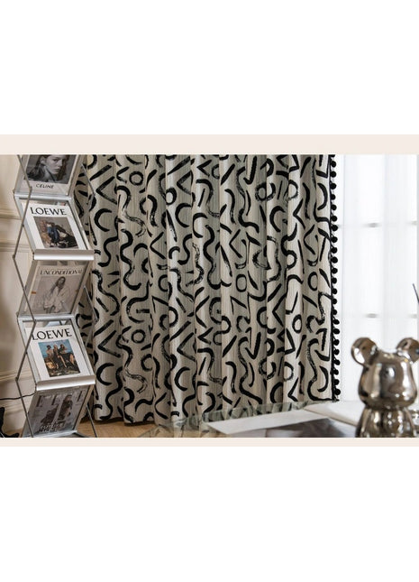 a curtain with a black and white pattern on it