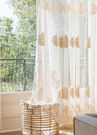 a bed sitting under a window next to a window sill