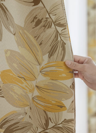 a person holding a piece of fabric with a flower pattern on it