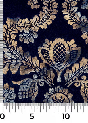 a ruler with a blue and gold pattern on it