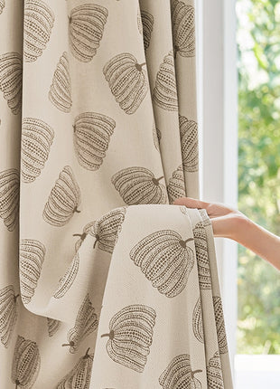 a person is opening the curtains with their hand