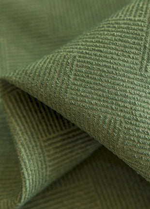 a close up view of a green fabric