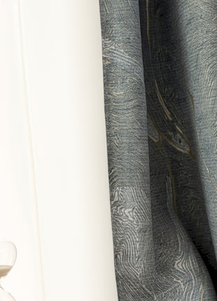 an hourglass sitting on top of a table next to a window