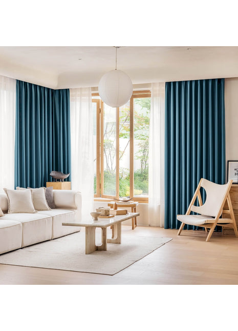 a living room filled with furniture and a large window