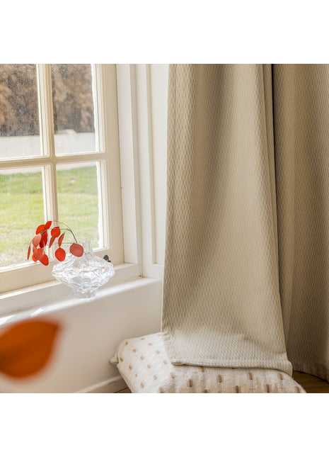 a vase of flowers sitting on a window sill