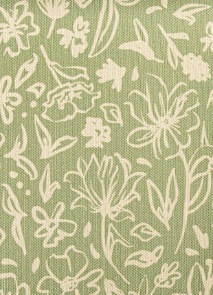 a close up of a green and white fabric with white flowers
