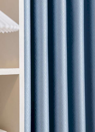 a shelf with a lamp and a blue curtain