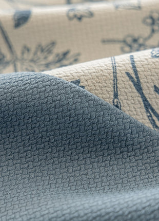 a close up of a blue and white fabric