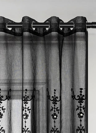 a black and white photo of a curtain