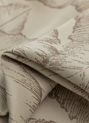 a close up of a fabric with leaves on it