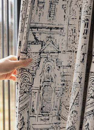a person holding a curtain with a drawing on it