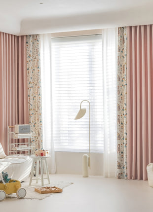 a living room with pink curtains and a white couch