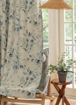 a living room with a chair and a lamp