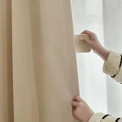 a child is holding a curtain with a light - colored curtain