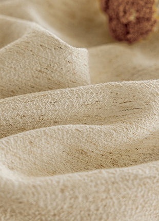 a piece of cake sitting on top of a white cloth