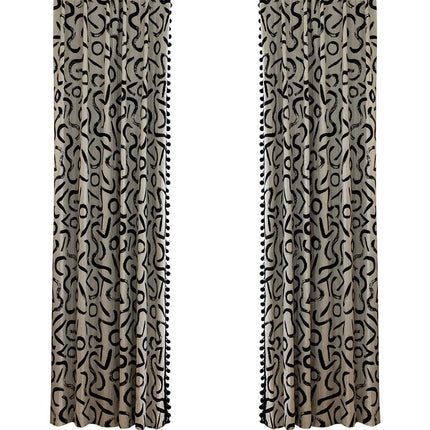 a pair of curtains with a black and white pattern