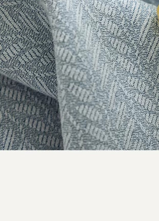 a close up of a blue and white fabric