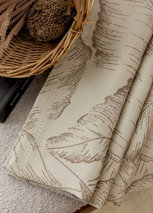 a table with a book and a basket on top of it