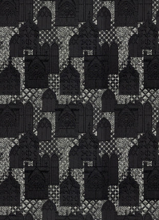 a black and white quilt with a pattern of bottles