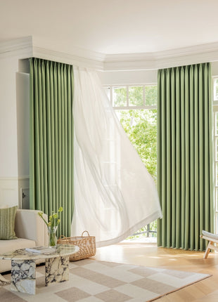 a living room filled with furniture and a large window