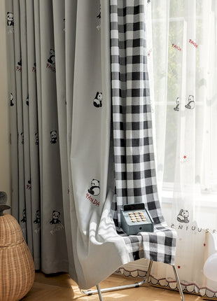 a room with a checkered curtain and a phone