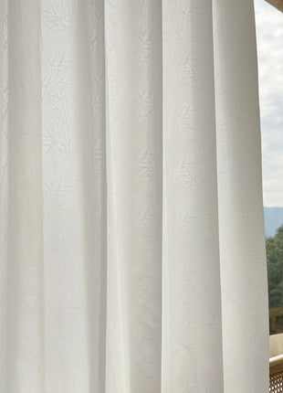 a cat sitting on top of a window sill