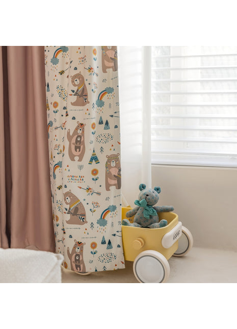 a teddy bear sitting in a wagon next to a window