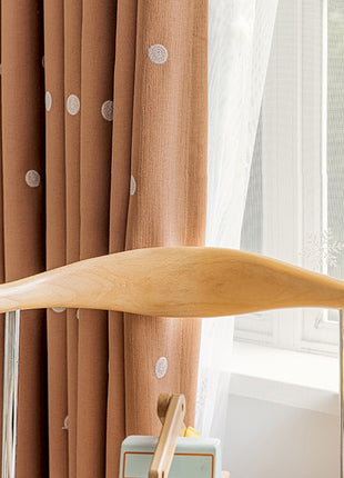 a wooden paddle sitting on top of a table next to a window