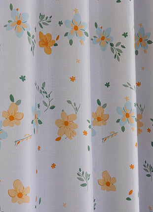 a close up of a curtain with flowers on it