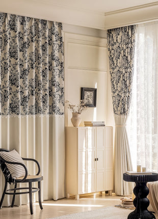 a living room filled with furniture and curtains