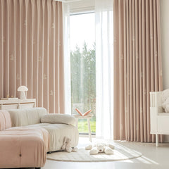 a living room filled with furniture and a large window