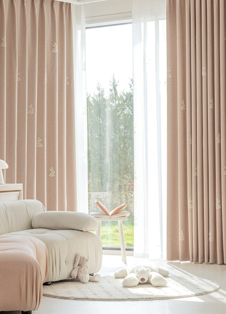 a living room filled with furniture and a large window