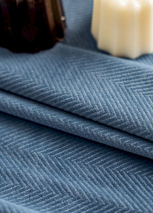 a close up of a cloth with a bottle of soap