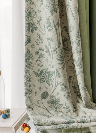 a window with a curtain and a vase with beads on it