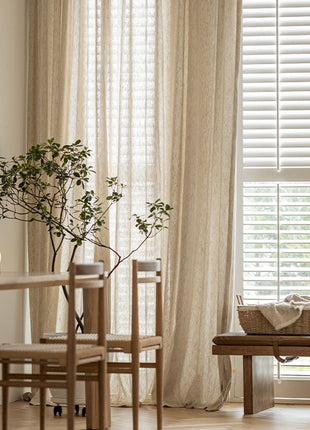 a living room with a table and chairs