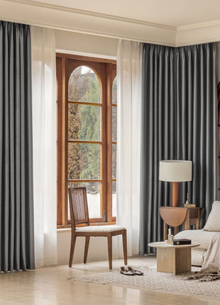 a living room filled with furniture and a large window