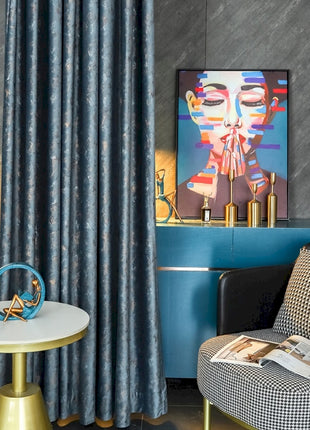 a living room with a chair and a painting on the wall