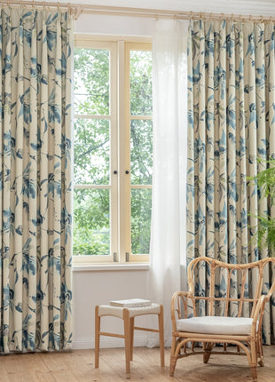 a living room with a chair and a window