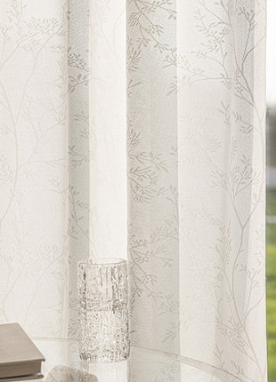 a window with a book and a vase on it